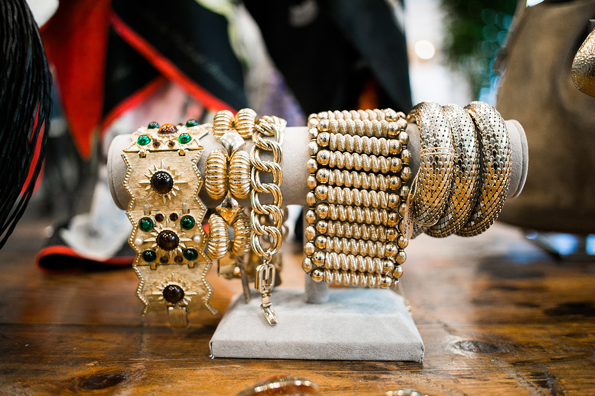 Various gold bracelets are on display.