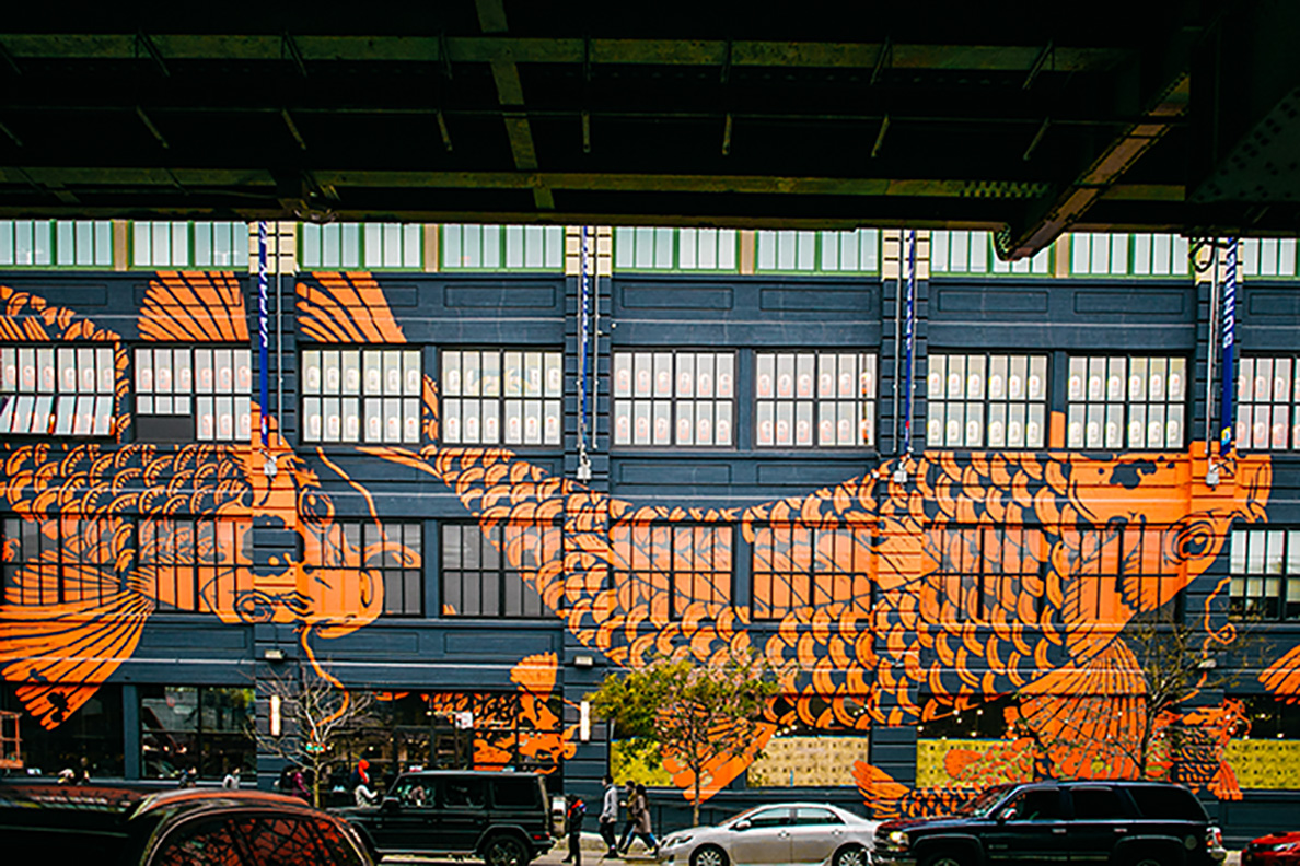 A large mural covers the side of a building.