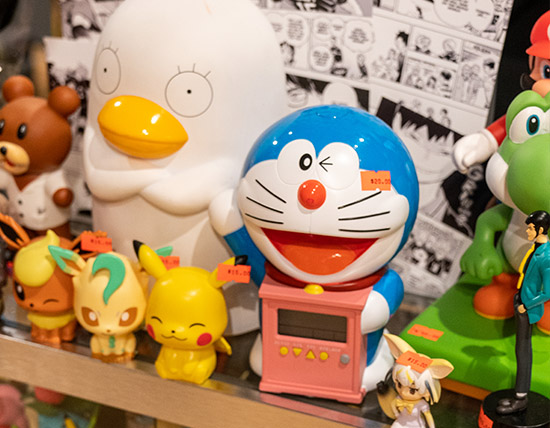 An up-close image of toys on a shelf.