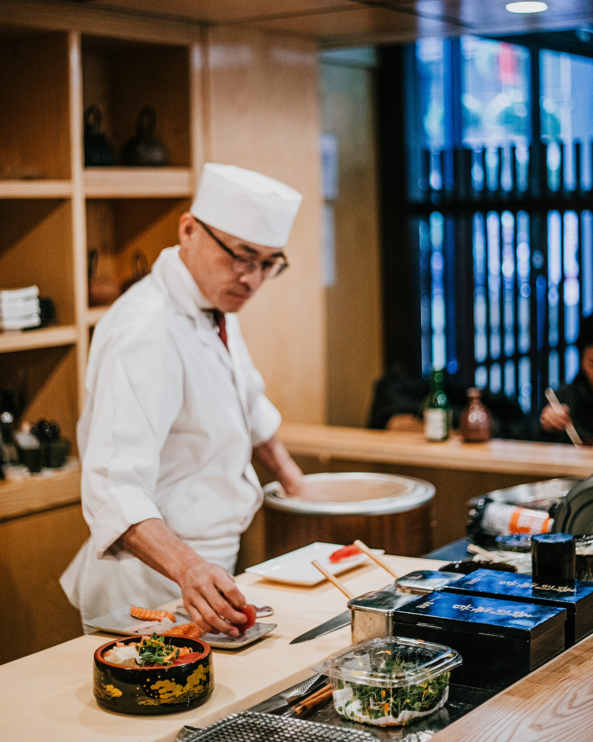 A chef is making sushi.