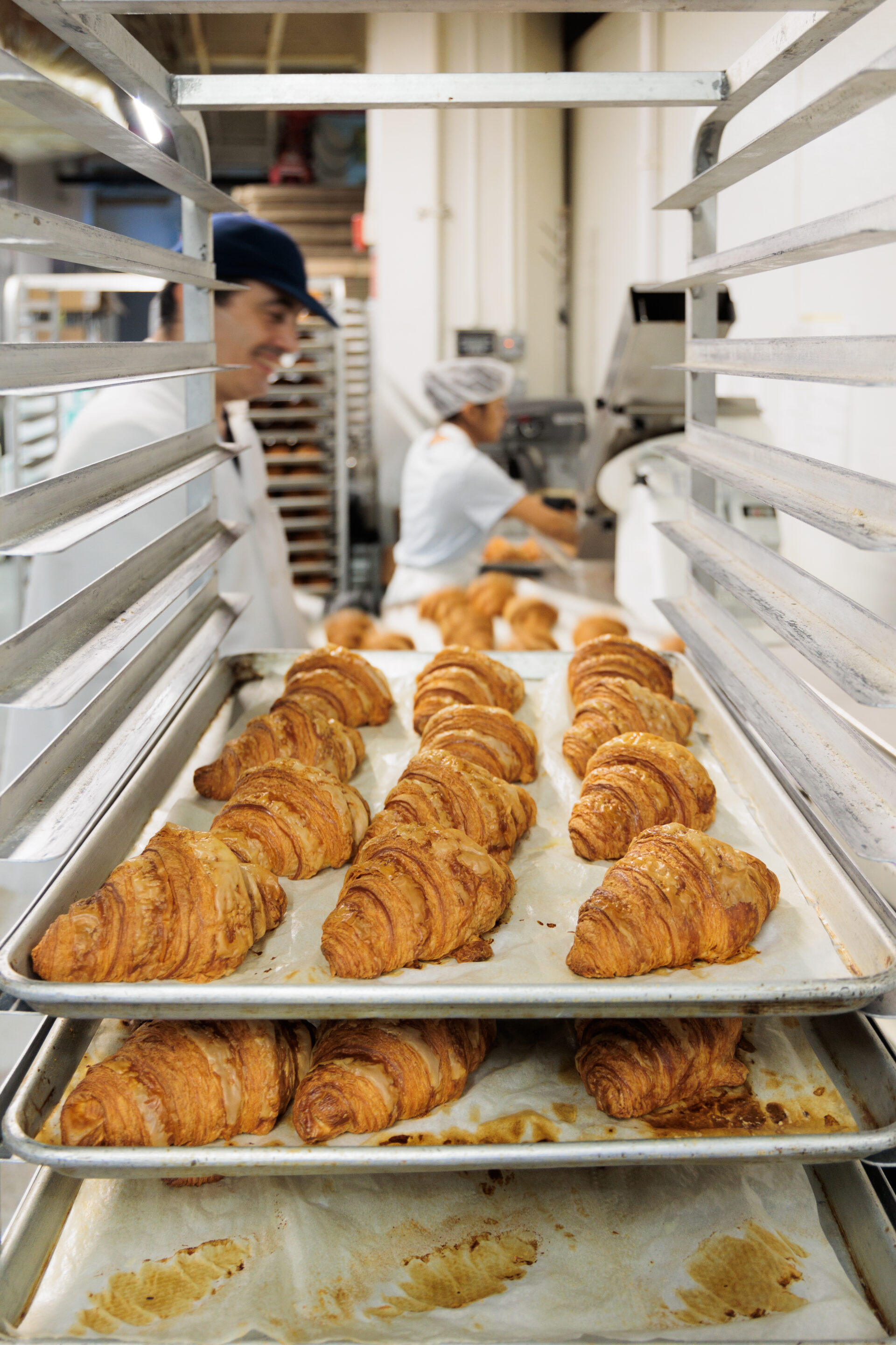 Someone is baking croissants at a bakery.