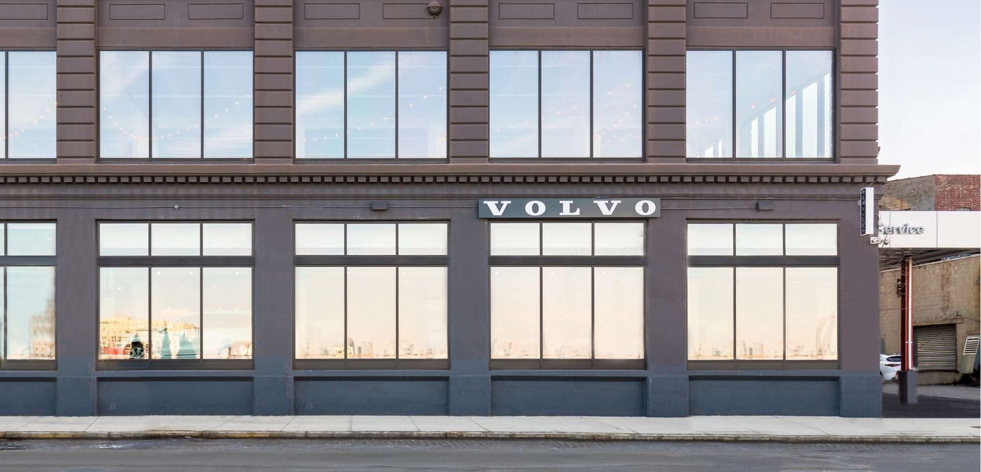 The exterior of a Volvo dealership.