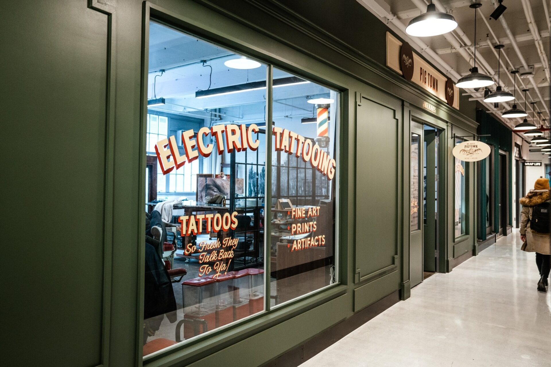 The exterior of a storefront called "Electric Tattoos."