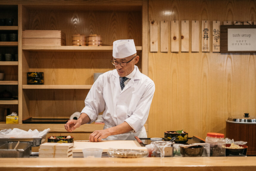 A chef is making sushi.