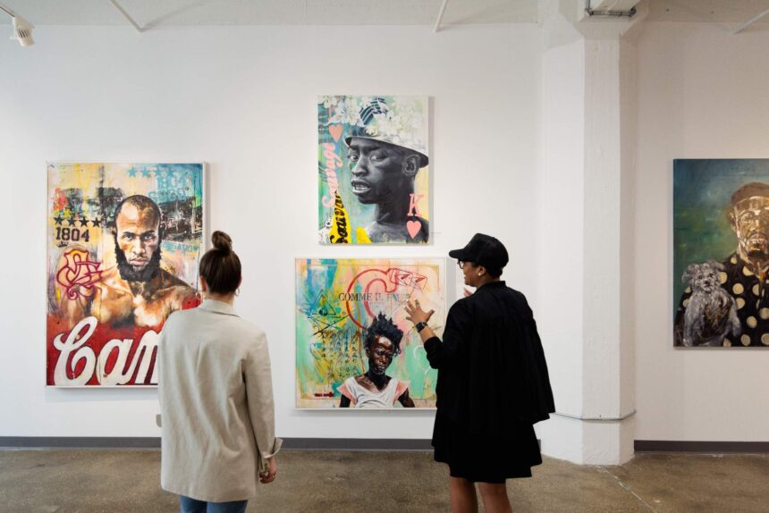 People are walking through an art gallery.