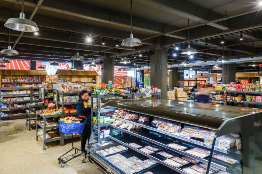 People are shopping in a grocery store.