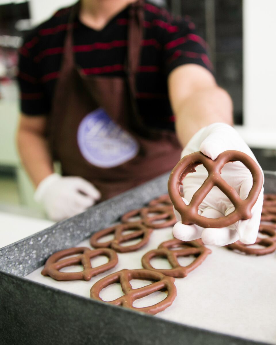 Someone is making chocolate-covered pretzels.
