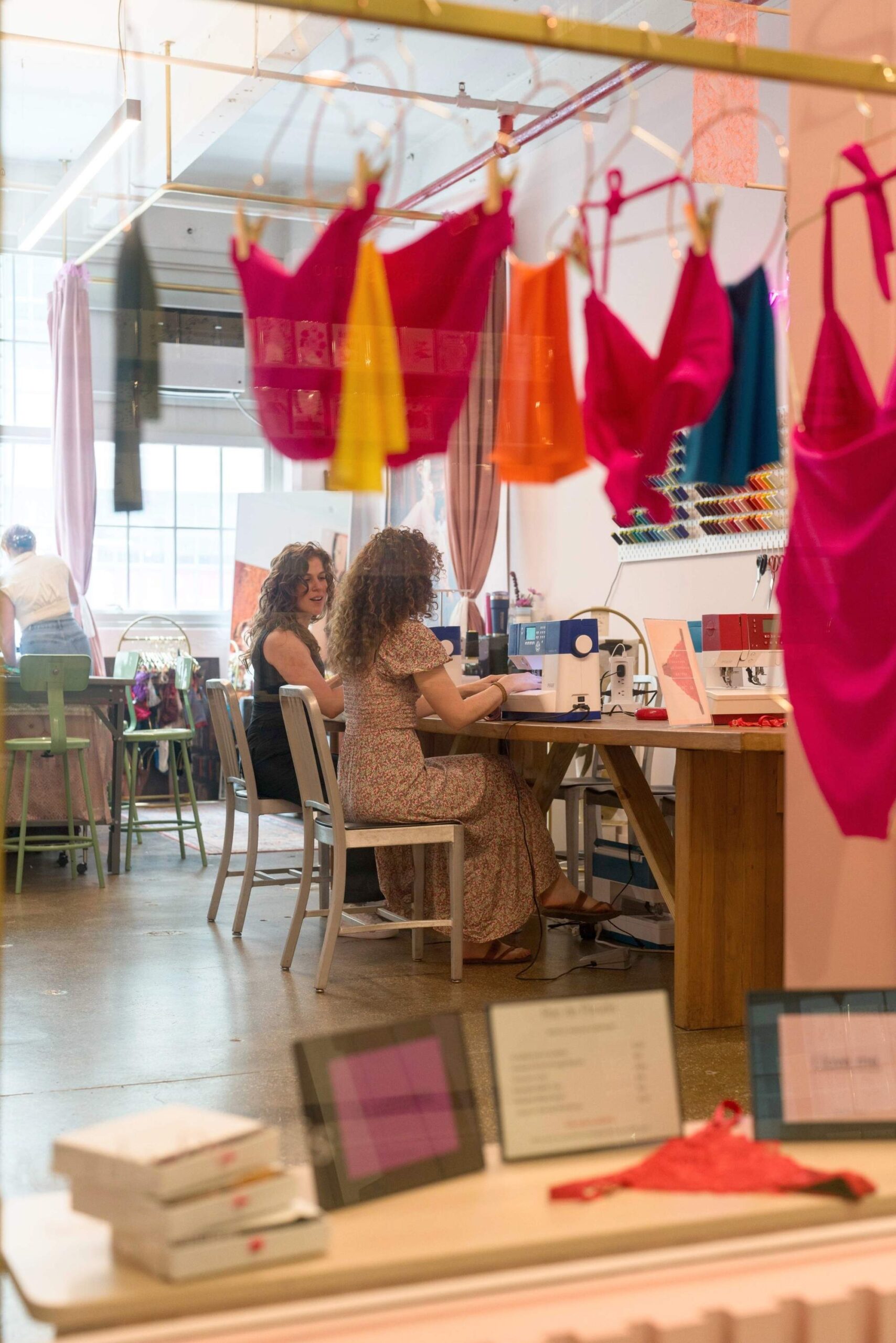 People are working in a clothing store.