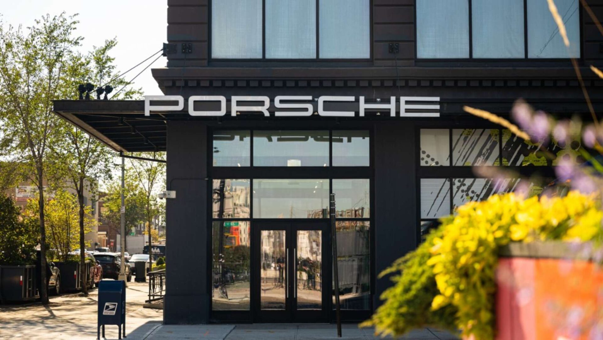 The exterior of a Porsche dealership.