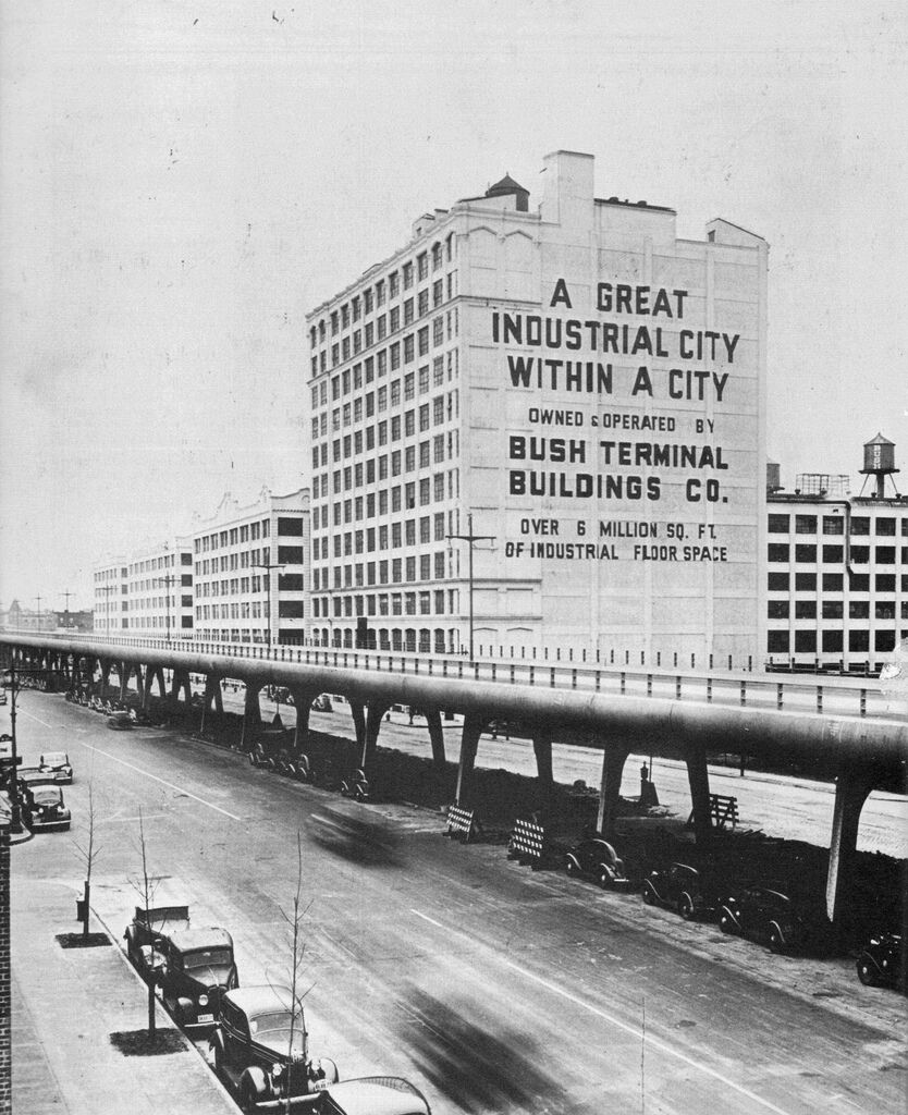 A historic image of a building that reads "A Great Industrial City Within a City."