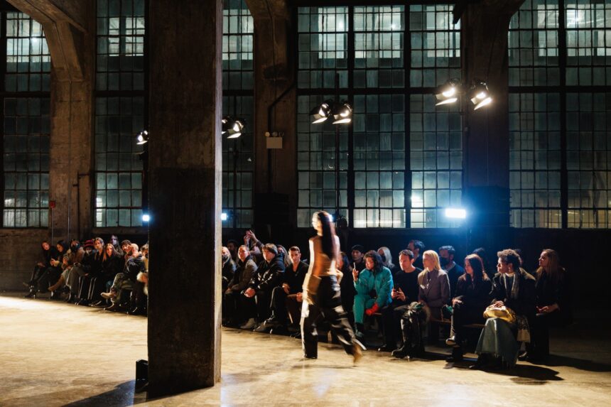 People sitting at a fashion runway show.
