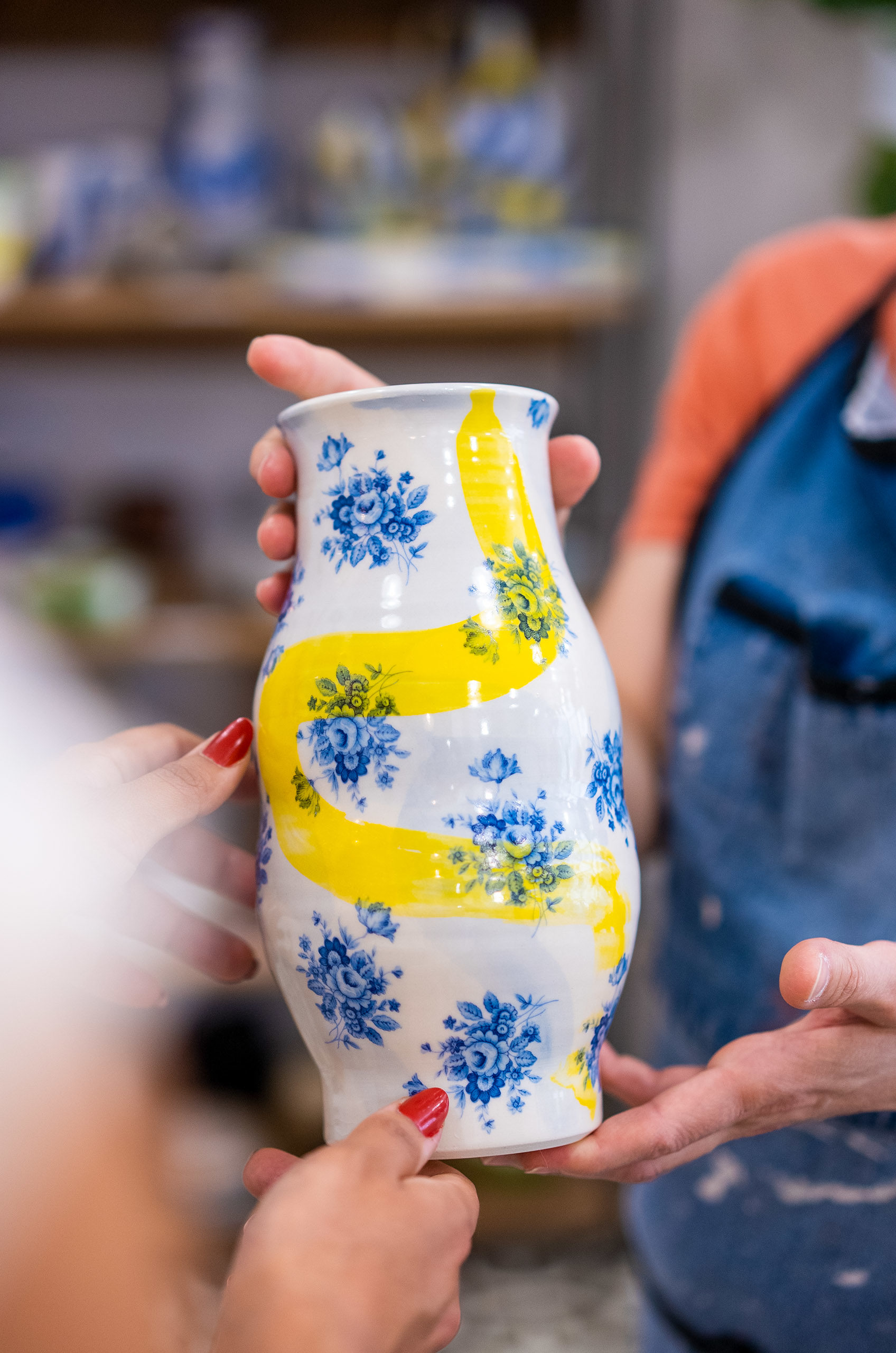 Image of someone holding a vase.